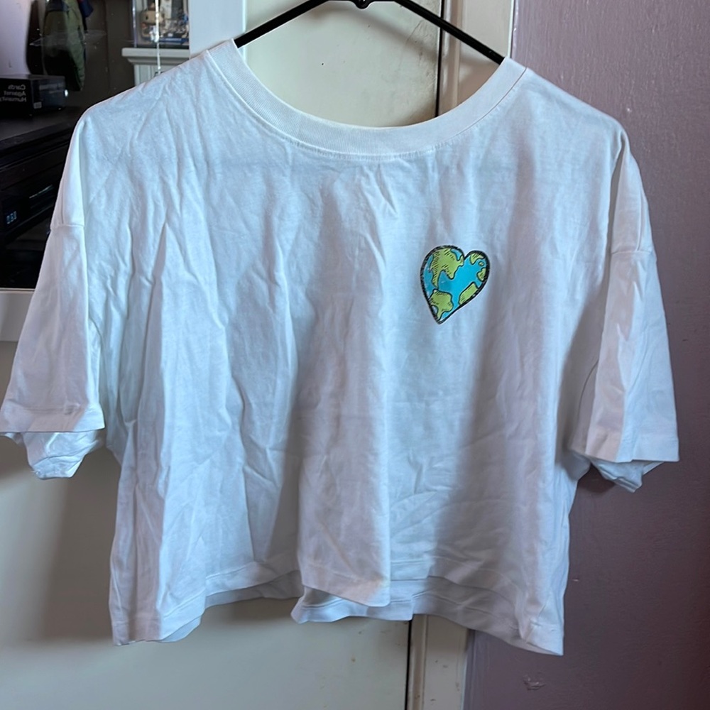 White earth crop top. On the back it says, “LOVE OUR PLANET EARTH”